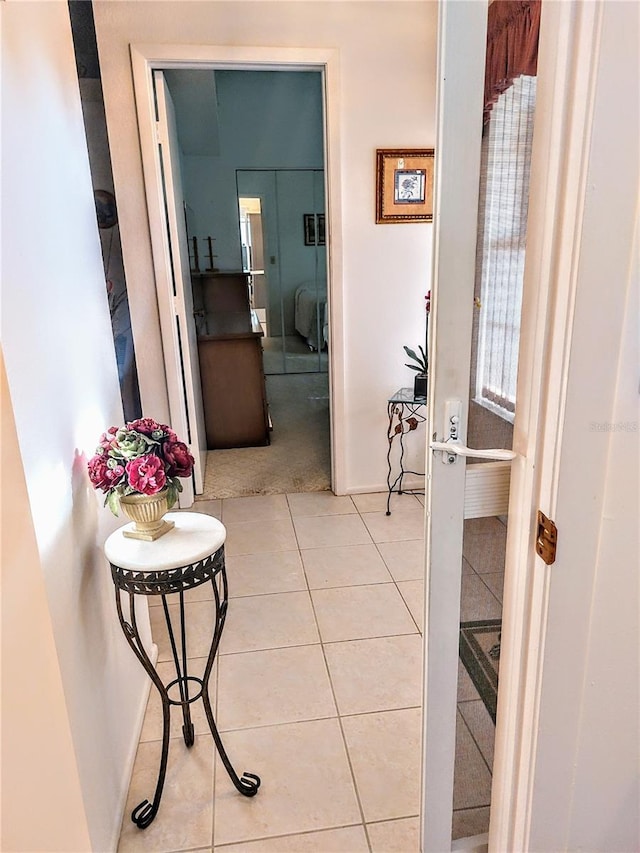 hallway featuring light tile patterned flooring