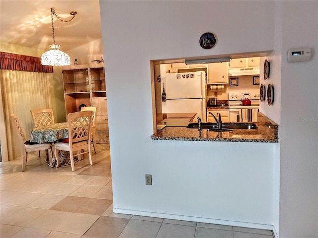 5650 Mashie Cir, North Port, FL 34287 - kitchen featuring white appliances, under cabinet range hood, a sink, tile patterned flooring, and hanging light fixtures