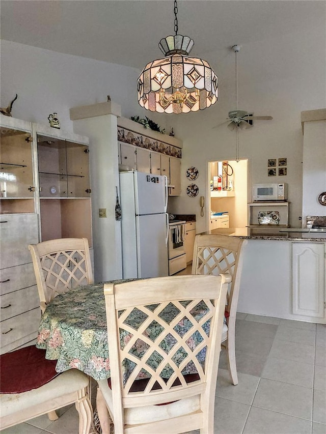 5650 Mashie Cir, North Port, FL 34287 - dining room with light tile patterned floors and ceiling fan