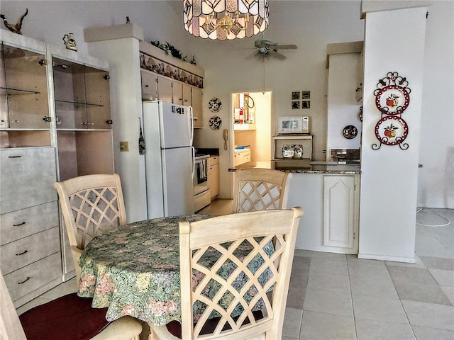 dining area with light tile patterned flooring