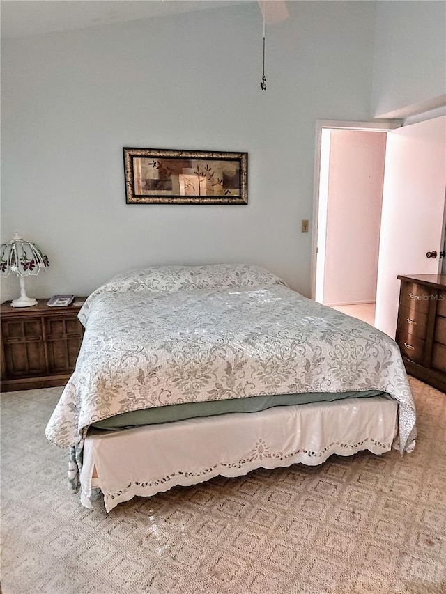 bedroom with light colored carpet and ceiling fan