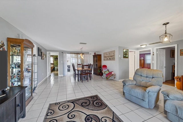 living room featuring light tile patterned flooring and a wealth of natural light