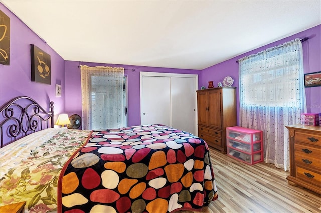 bedroom featuring a closet and light hardwood / wood-style floors