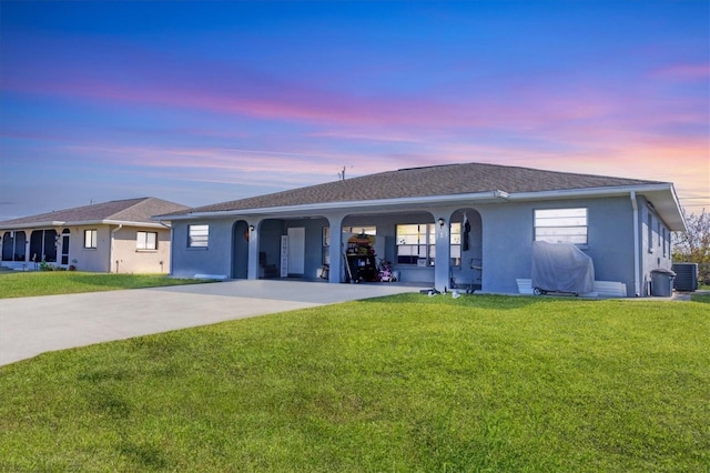 single story home with a yard and central air condition unit