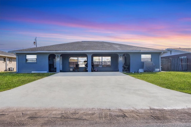 ranch-style home featuring a yard