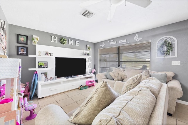 tiled living room with ceiling fan