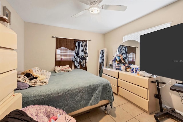 bedroom with light tile patterned floors and ceiling fan