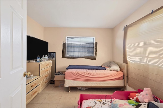 bedroom with light tile patterned floors