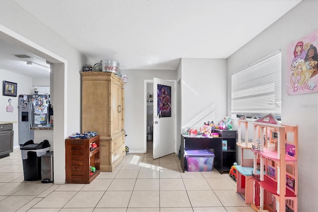 game room featuring light tile patterned flooring