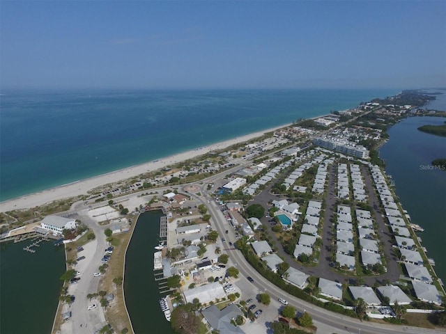 aerial view featuring a water view and a beach view