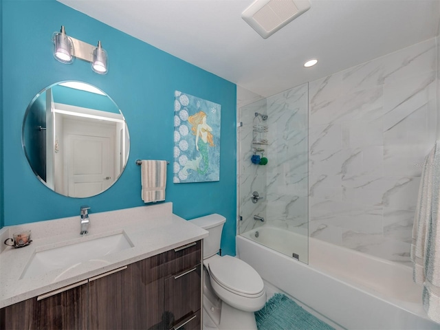 full bathroom with toilet, tiled shower / bath combo, and vanity