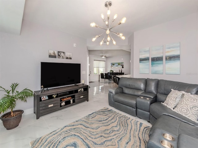 living room featuring ceiling fan with notable chandelier