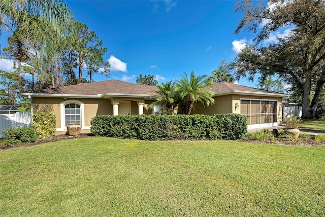 ranch-style home featuring a front yard