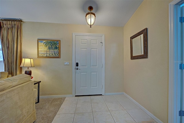 entryway with light tile patterned floors