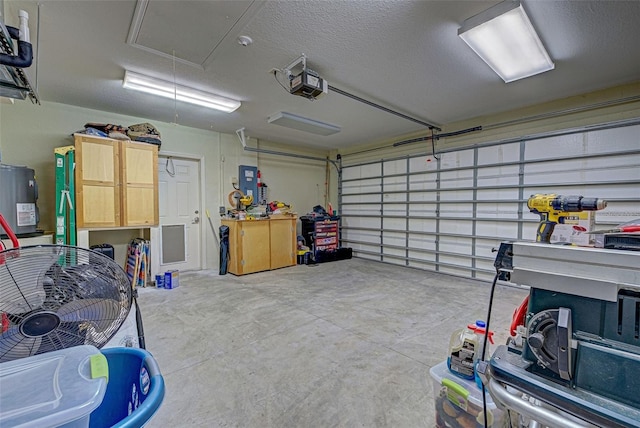 garage featuring a garage door opener and water heater