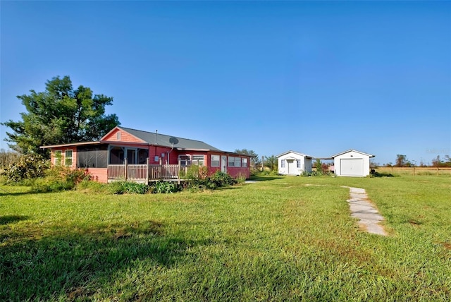 view of yard with a sunroom