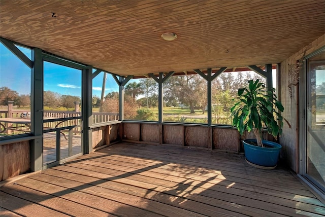 unfurnished sunroom featuring wooden ceiling