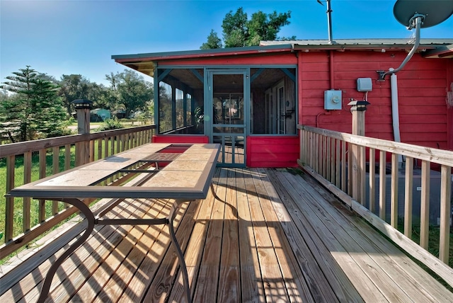 deck with a sunroom