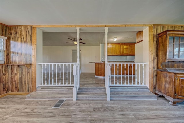 entrance to property with ceiling fan