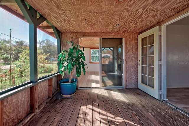 unfurnished sunroom with wood ceiling