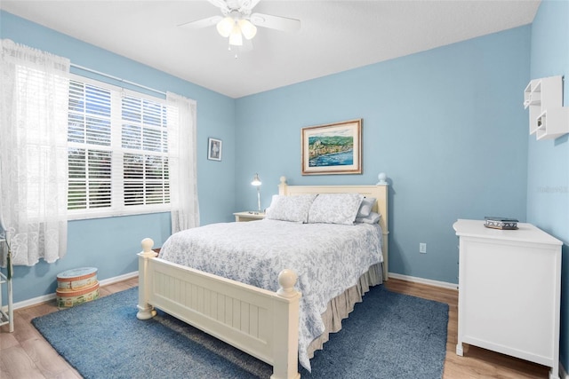 bedroom featuring light hardwood / wood-style floors and ceiling fan