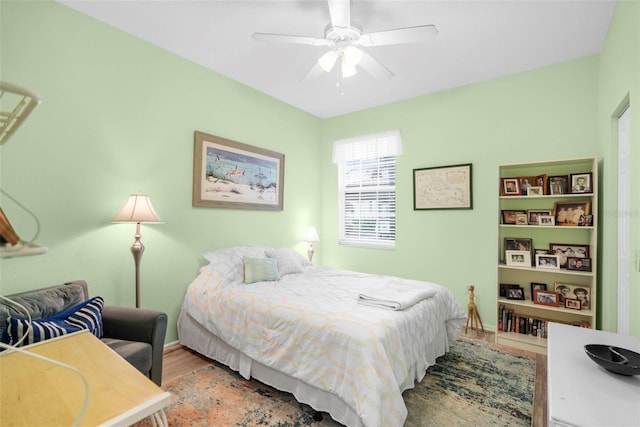 bedroom with ceiling fan and light wood-type flooring