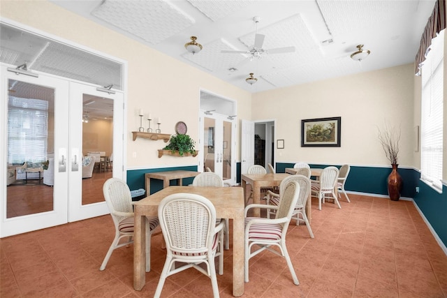 dining space featuring french doors and ceiling fan