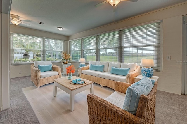 sunroom / solarium with ceiling fan