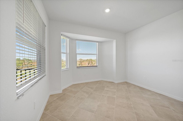 empty room featuring light tile patterned floors