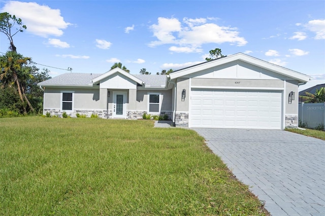 view of front of house featuring a front yard and a garage