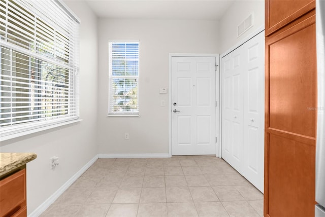 interior space with light tile patterned floors