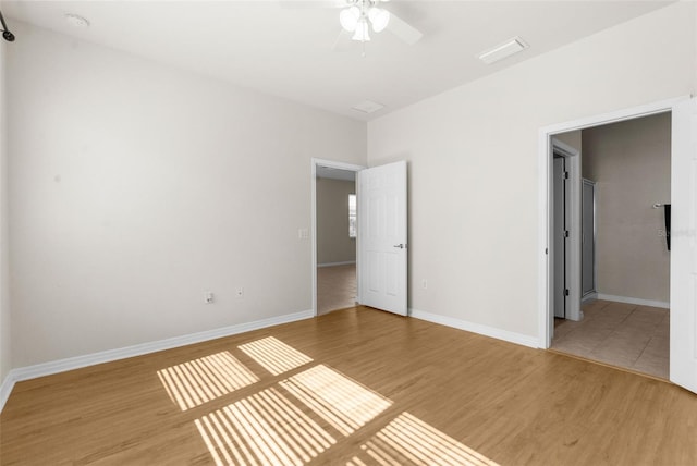 unfurnished bedroom featuring hardwood / wood-style flooring and ceiling fan