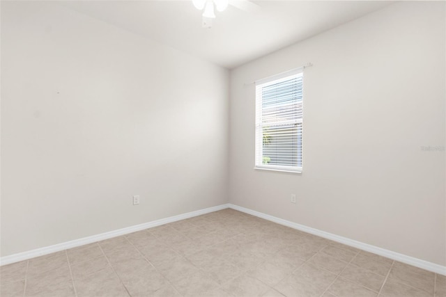 spare room with ceiling fan