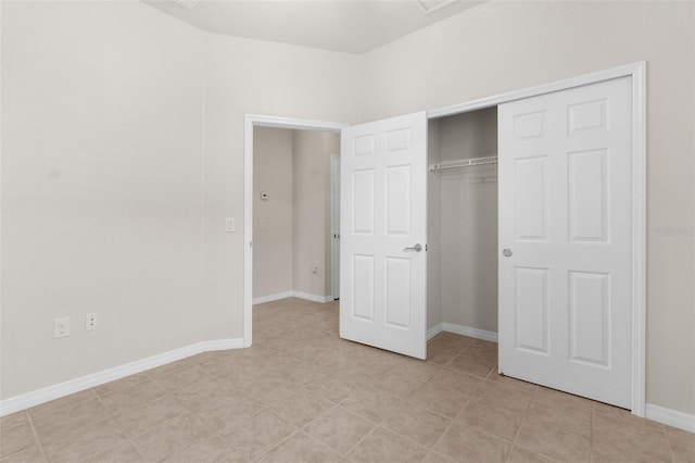 unfurnished bedroom with a closet