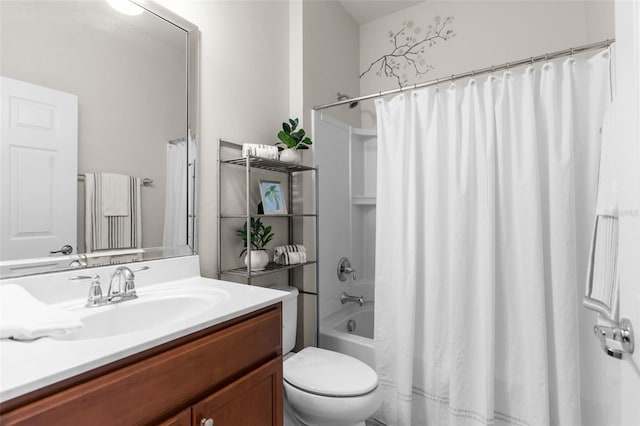 full bathroom featuring vanity, shower / bath combination with curtain, and toilet