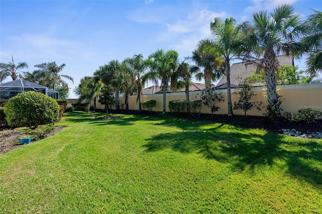 view of yard featuring a lanai