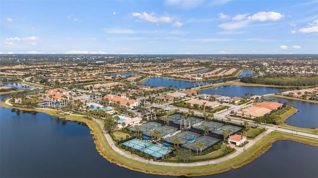 birds eye view of property with a water view