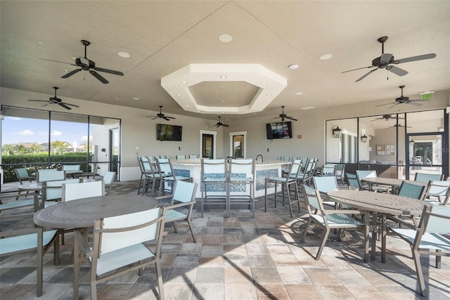 dining area with a raised ceiling