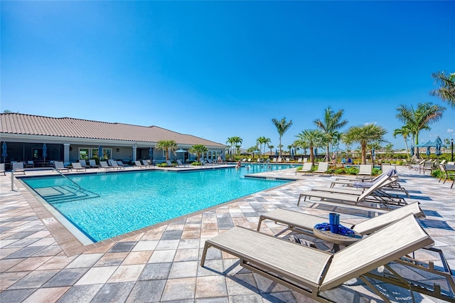 view of swimming pool with a patio