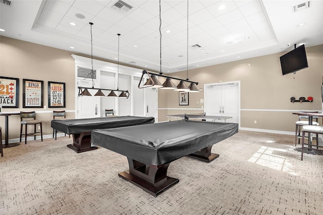 playroom with light carpet, pool table, and a tray ceiling