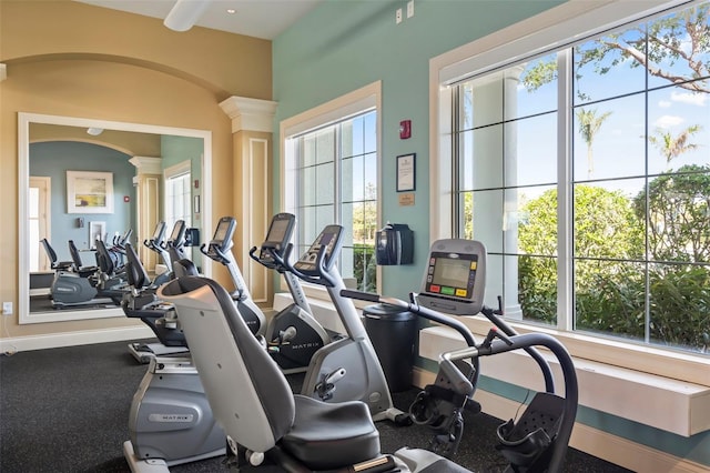 workout area featuring decorative columns