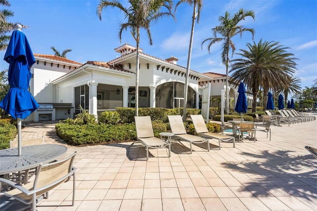 rear view of house featuring a patio