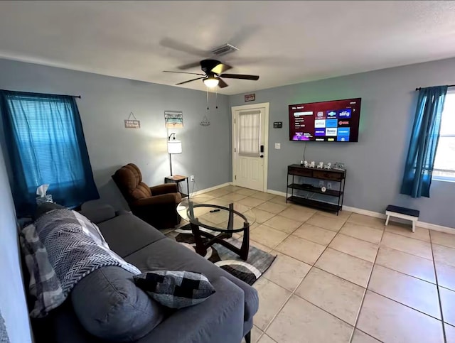 tiled living room featuring ceiling fan