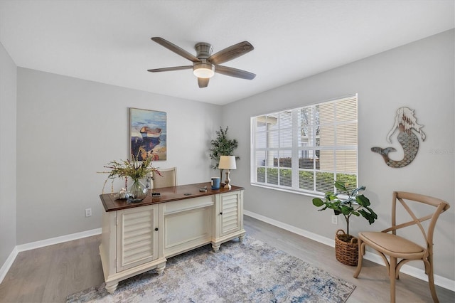 office area with hardwood / wood-style floors and ceiling fan