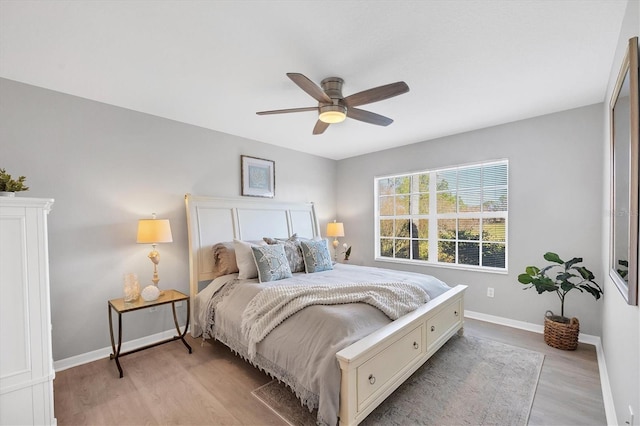 bedroom featuring ceiling fan and light wood-type flooring