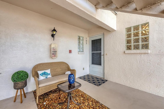 doorway to property featuring a patio area