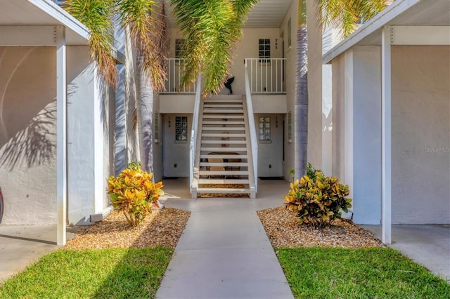 804 Montrose Dr Unit 103, Venice, FL 34293 - doorway to property with stucco siding