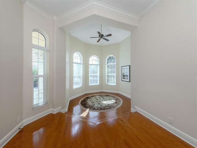 interior space with crown molding, hardwood / wood-style flooring, and ceiling fan