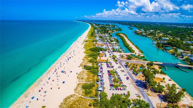 aerial view featuring a water view and a view of the beach