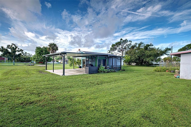 view of yard featuring a patio area and a carport